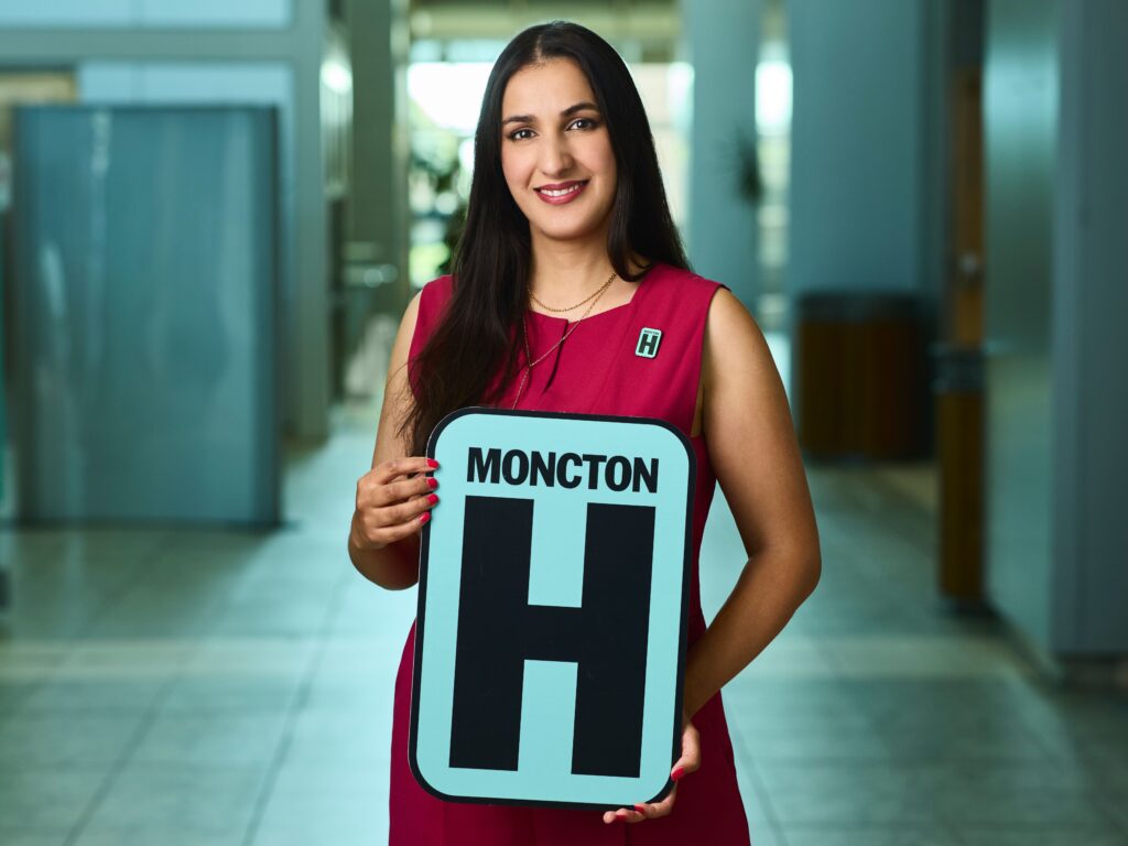 Sophia  Holding H Sign and Smiling at camera